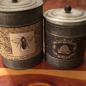 Set of 2 tin bee canisters.